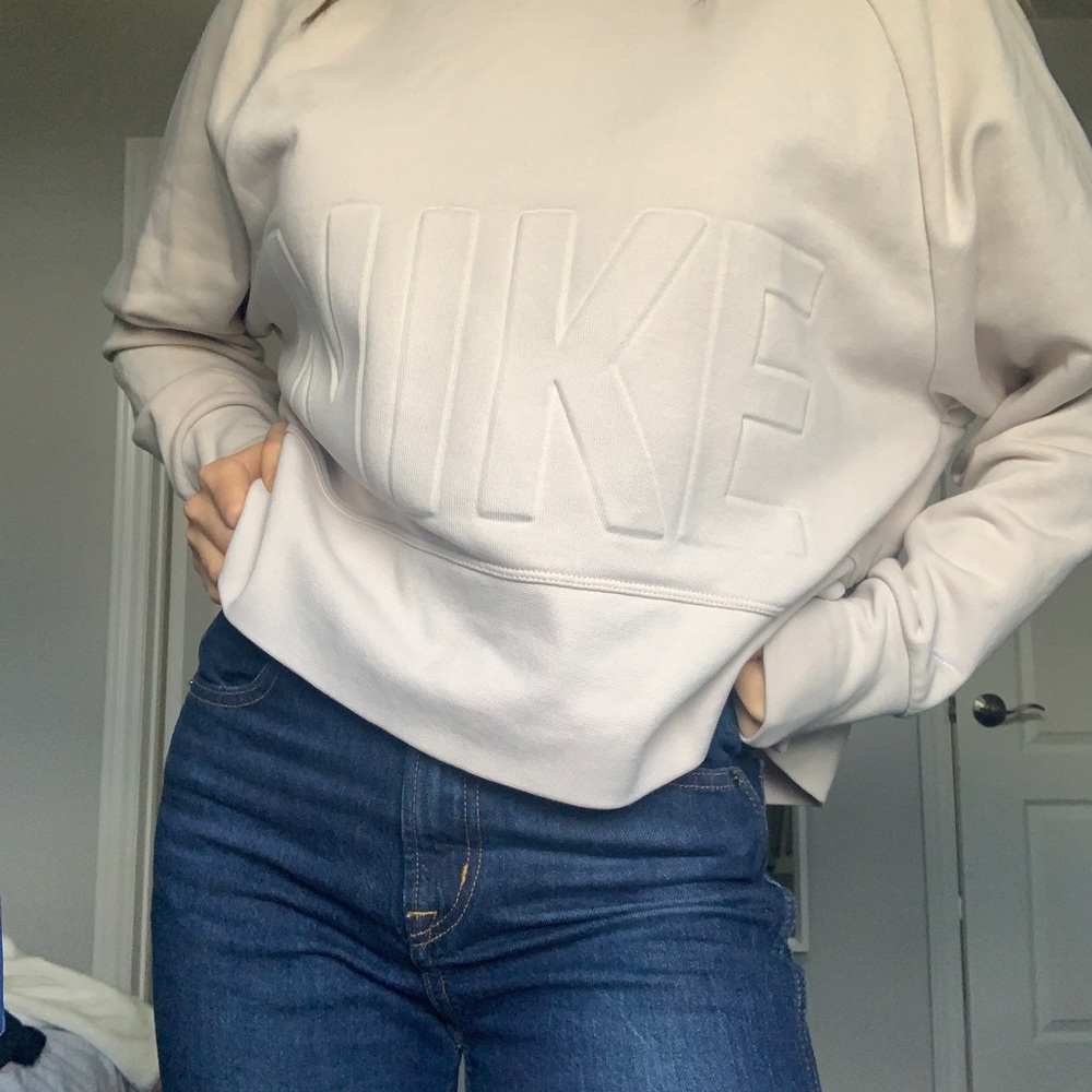 Cream Nike oversized crewneck originally from Aritzia